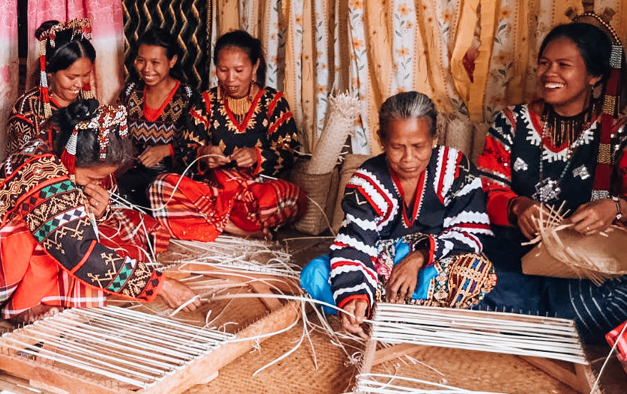 Load video: women weavers from the T&#39;boli tribe in the Philippines weaving the rattan for our bags