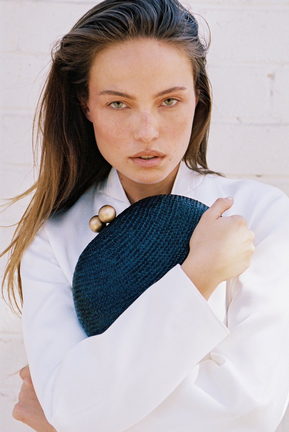 THE HELENA — Black Woven Straw Clutch with Gold Ball Clasp