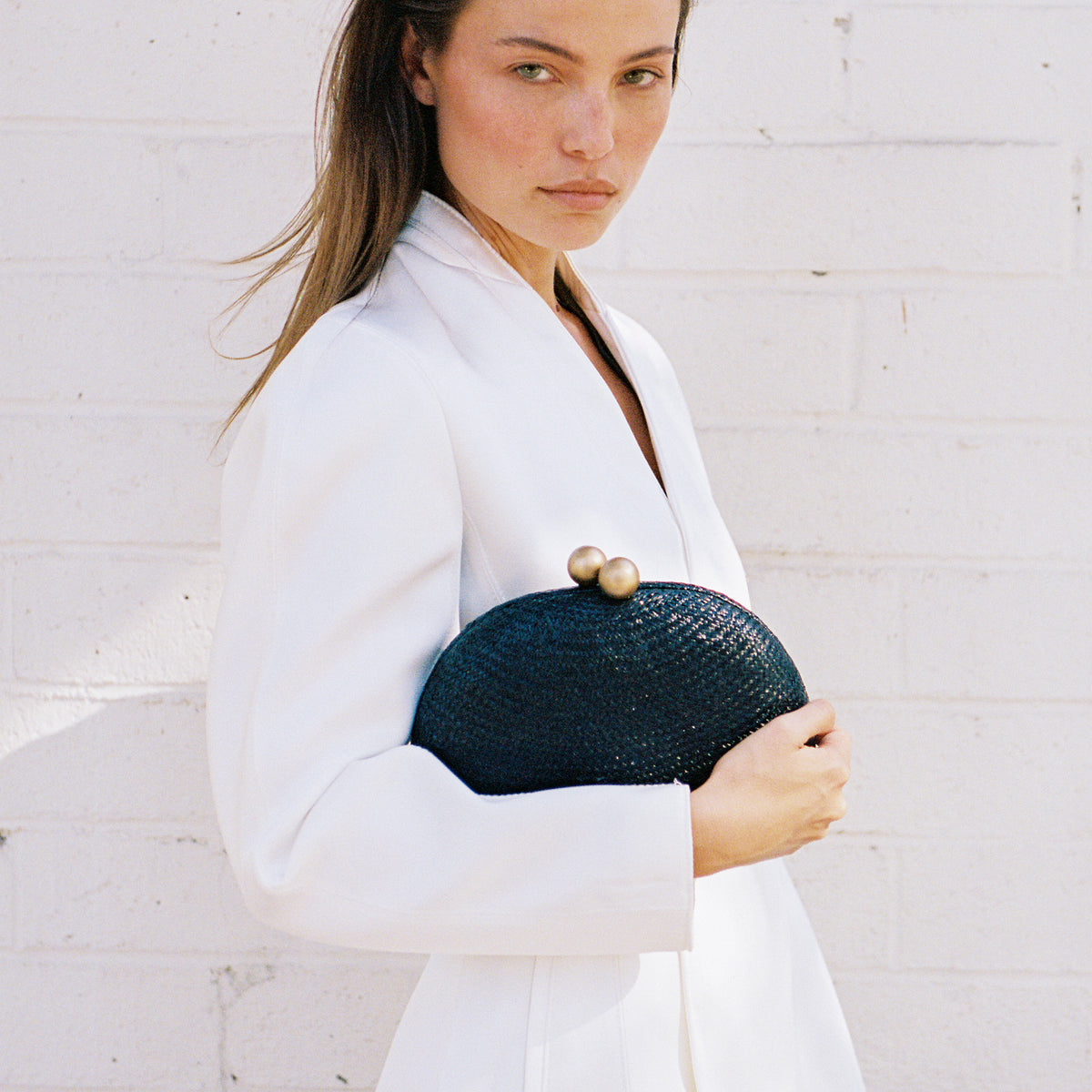 THE HELENA — Black Woven Straw Clutch with Gold Ball Clasp