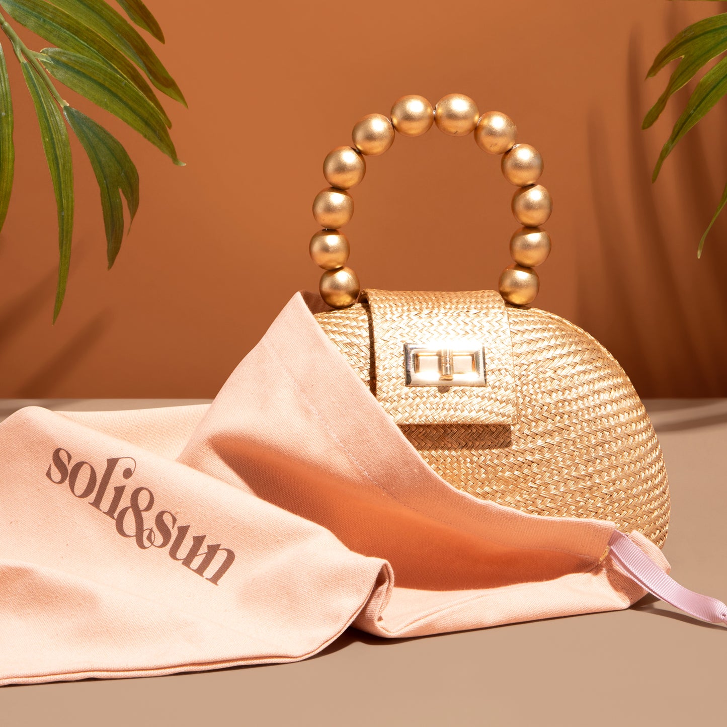 THE ORLA Gold Woven Straw & Wooden Bead Statement Clutch Bag