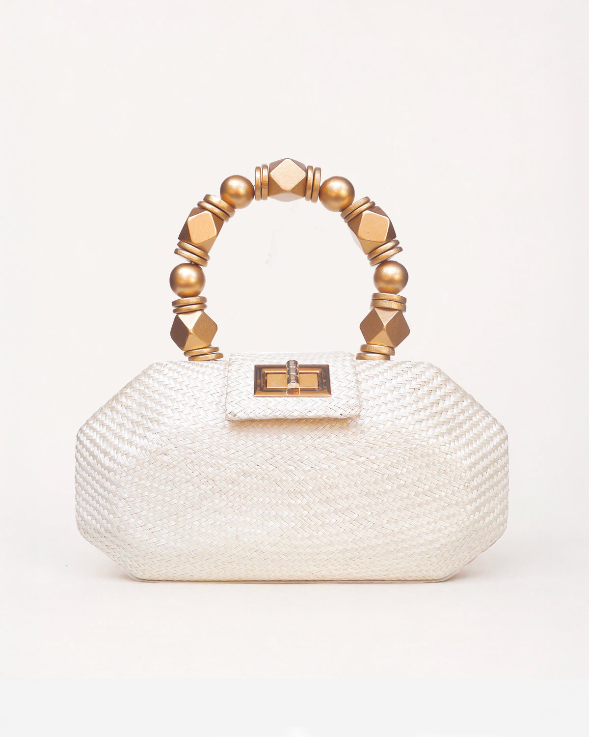 The Melia cream woven straw clutch bag with gold beaded top handle, front view