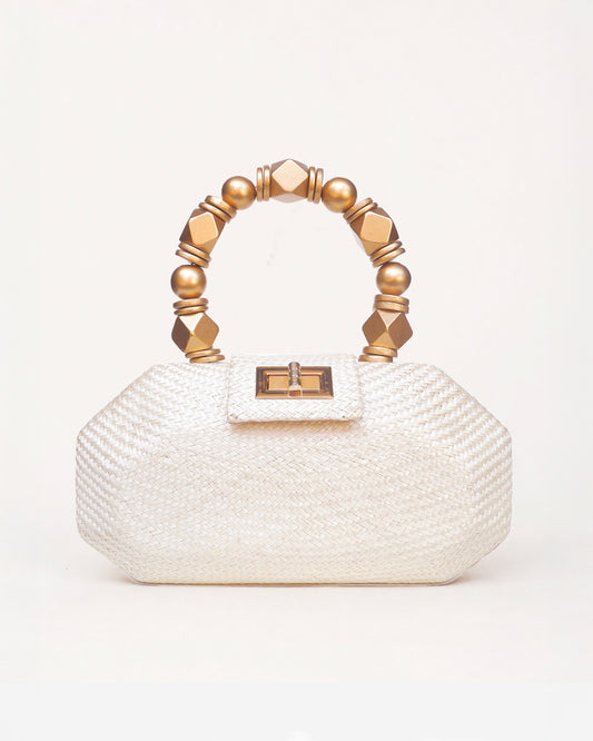 The Melia cream woven straw clutch bag with gold beaded top handle, front view