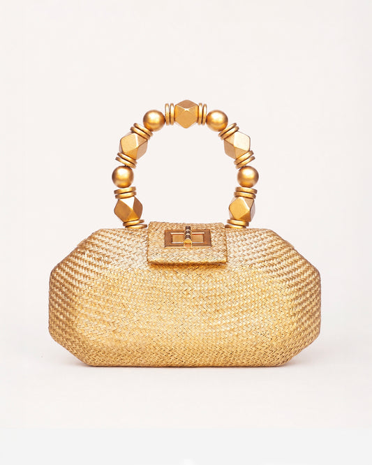 The Melia gold woven straw clutch bag with gold beaded top handle, front view