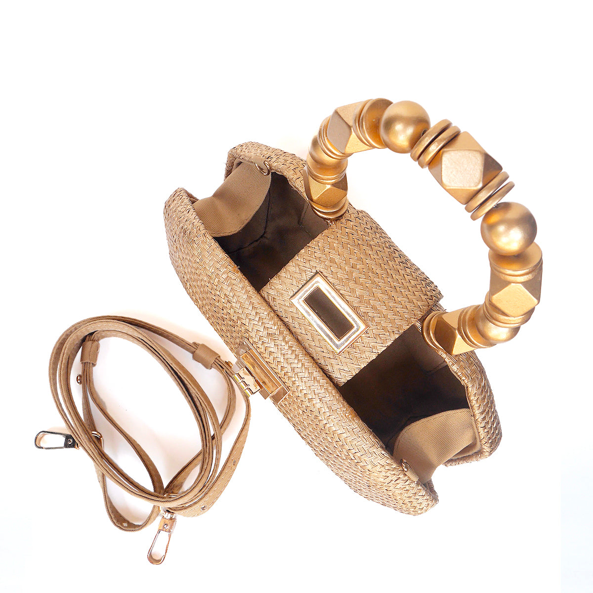 The Melia gold bag open, showing lined interior and detachable crossbody strap