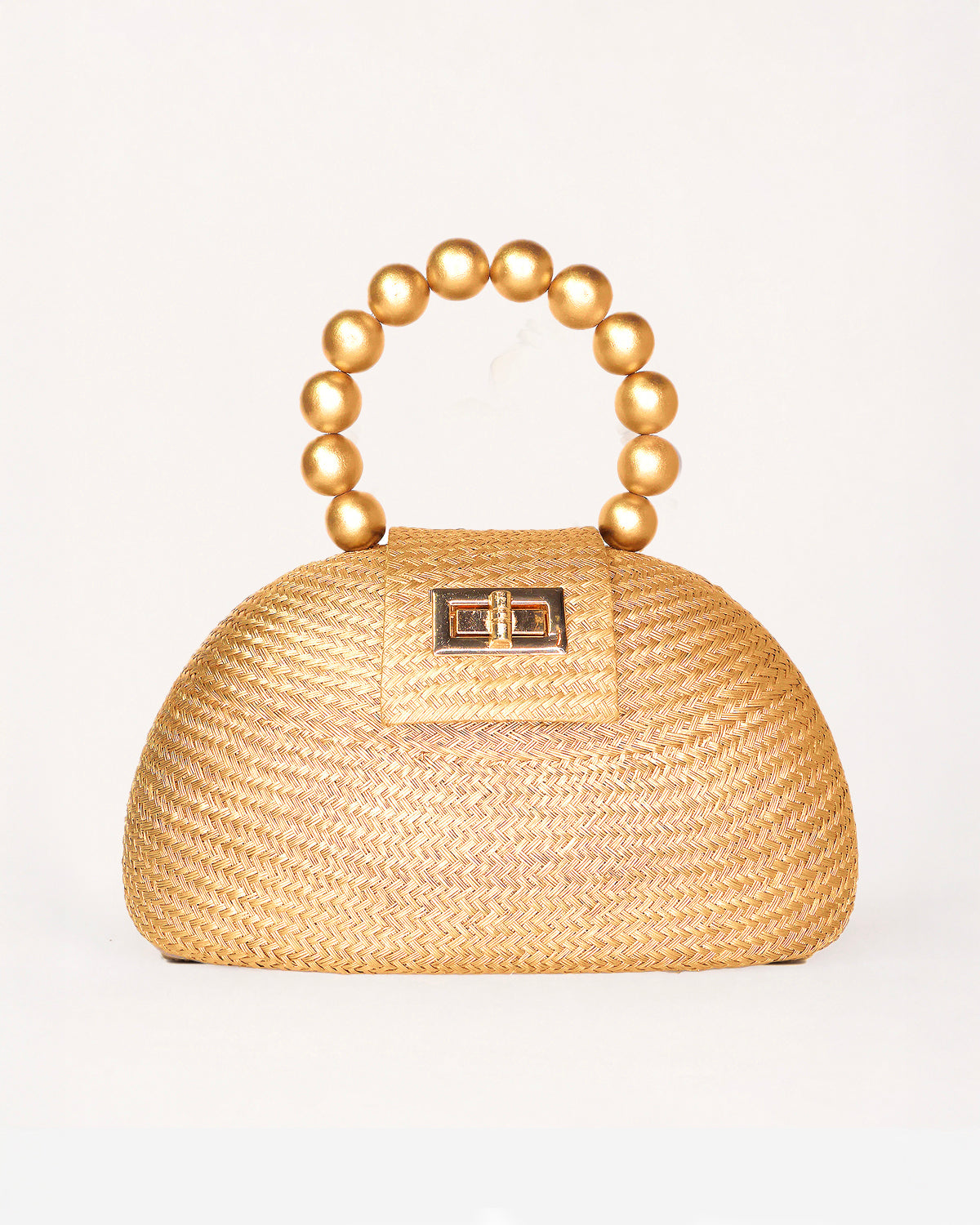 The Orla gold woven straw half-moon bag with pearl beaded handle, front view