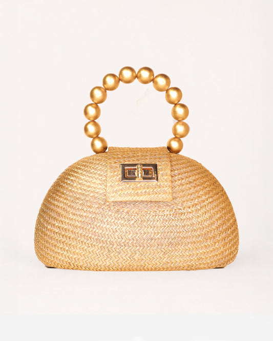 The Orla gold woven straw half-moon bag with pearl beaded handle, front view
