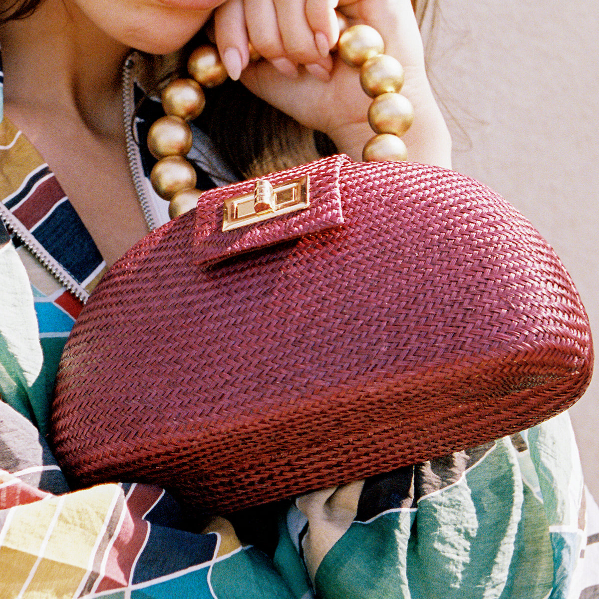 THE ORLA — Maroon Woven Straw Half-Moon Bag with Gold Beaded Handle