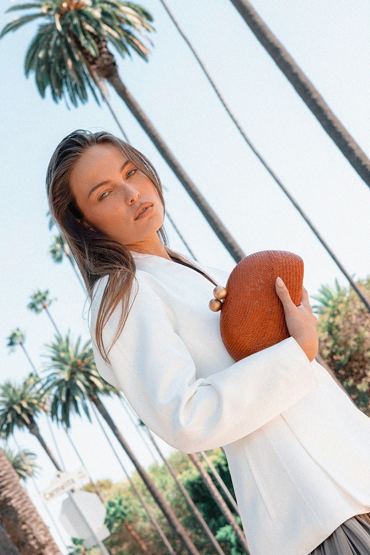 THE HELENA — Terracotta Woven Straw Clutch with Gold Ball Clasp
