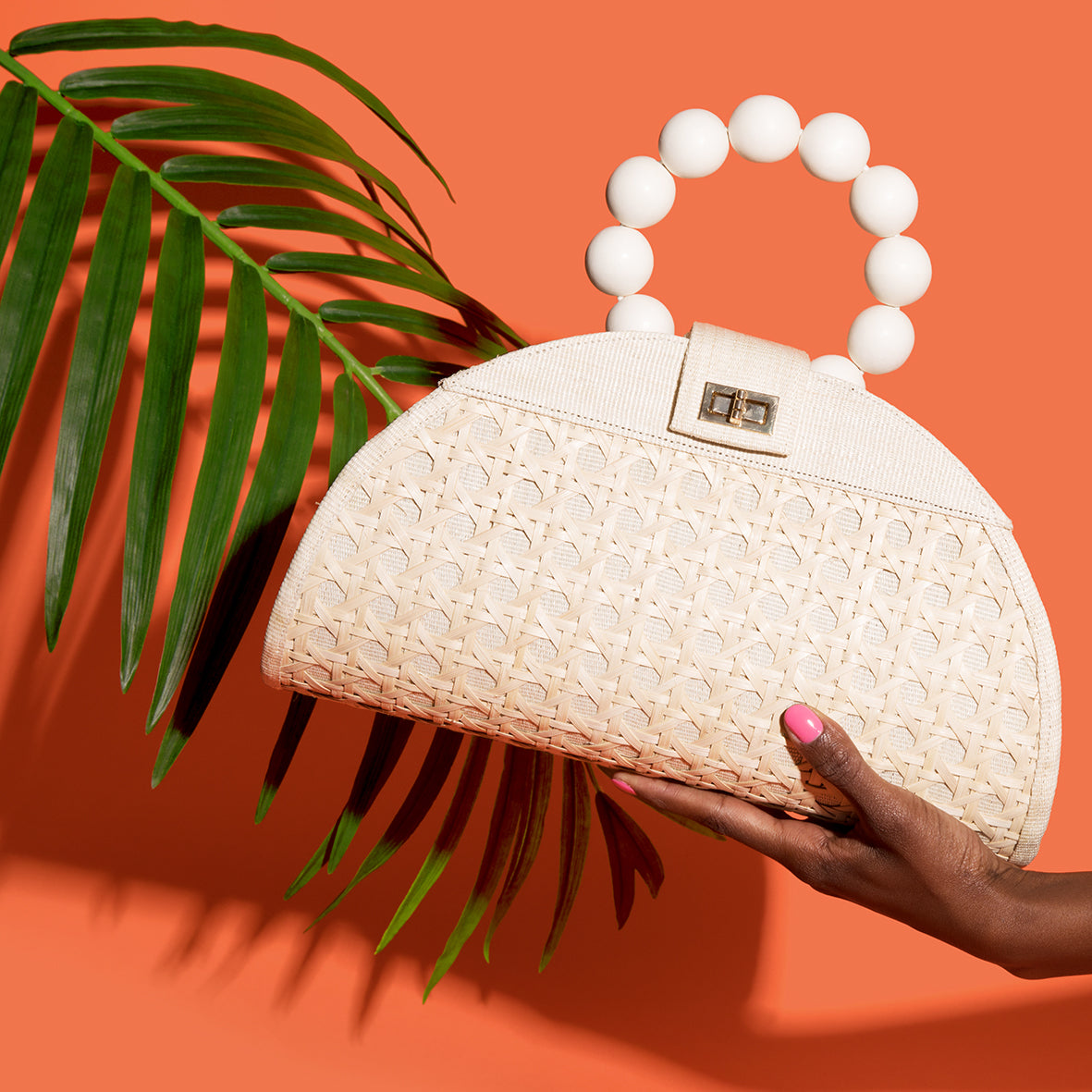 Cream woven rattan statement vacation bag