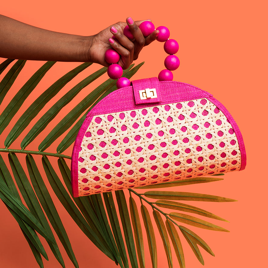 Pink woven rattan resort style statement bag